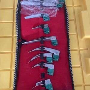 Green and Silver Medical Laryngoscope Set